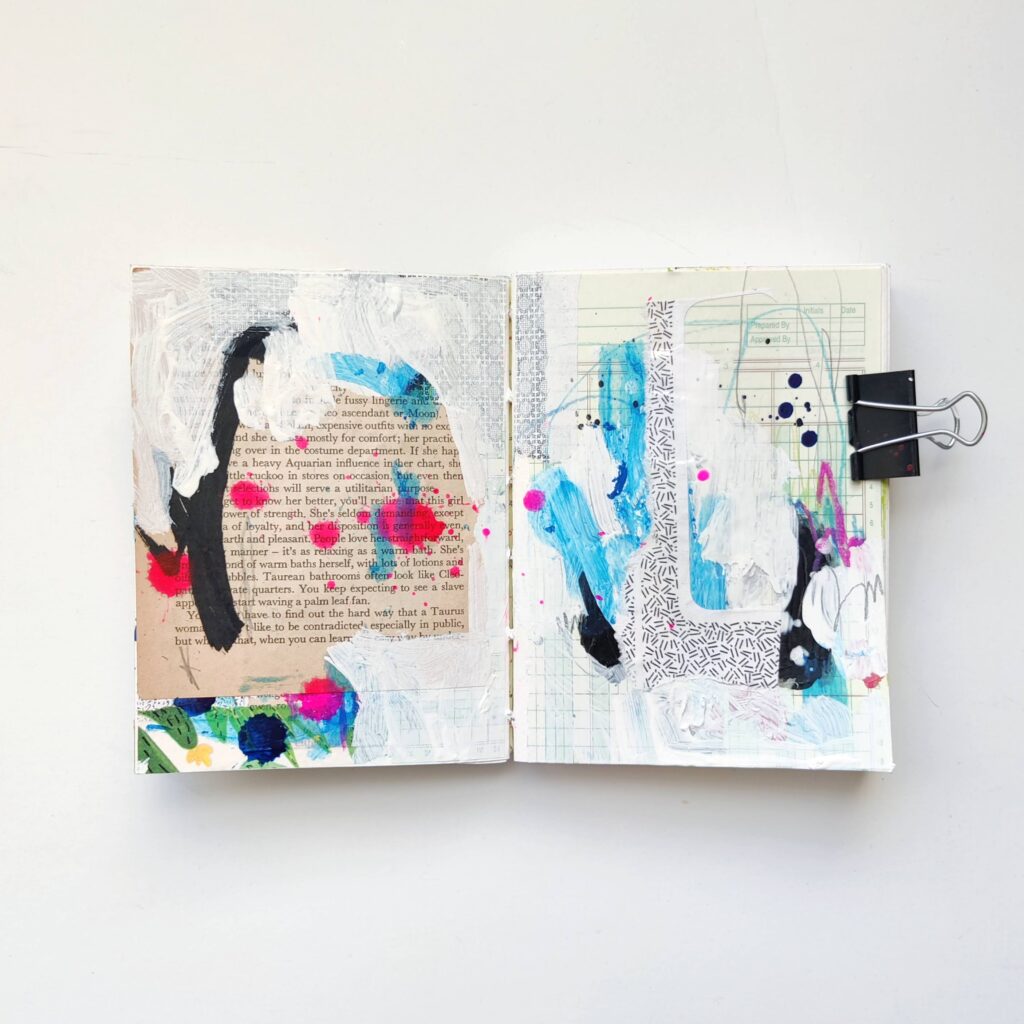 Ingrid Murray's art journal. Elements of collage and mark-making have been collaged over and painted over so that only a few strokes of blue, black, and pink paint show through.