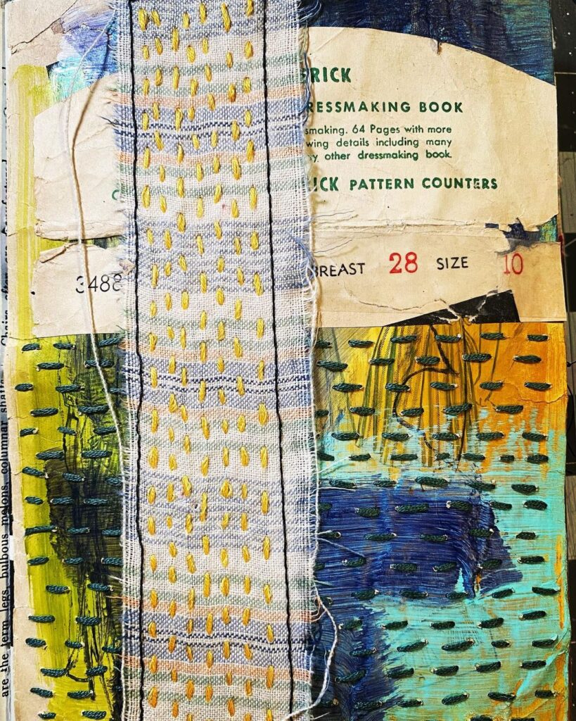 Mixed media page with various cloths stitched onto paper.