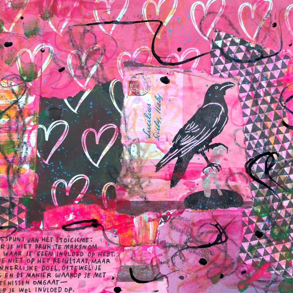 Detail of a mixed media art journal page. Collaged papers (repeating hearts and a crow are visible) are accented with pinks.